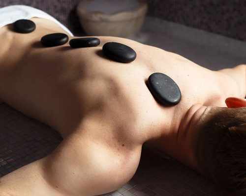 Erotic massage with hot stones